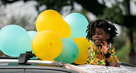  Journee Duncan, 6, waves from a float during the 156th annual Emancipation Proclamation parade celebrating the freeing of African-American slaves, January 1, 2022 in Charleston, South Carolina.